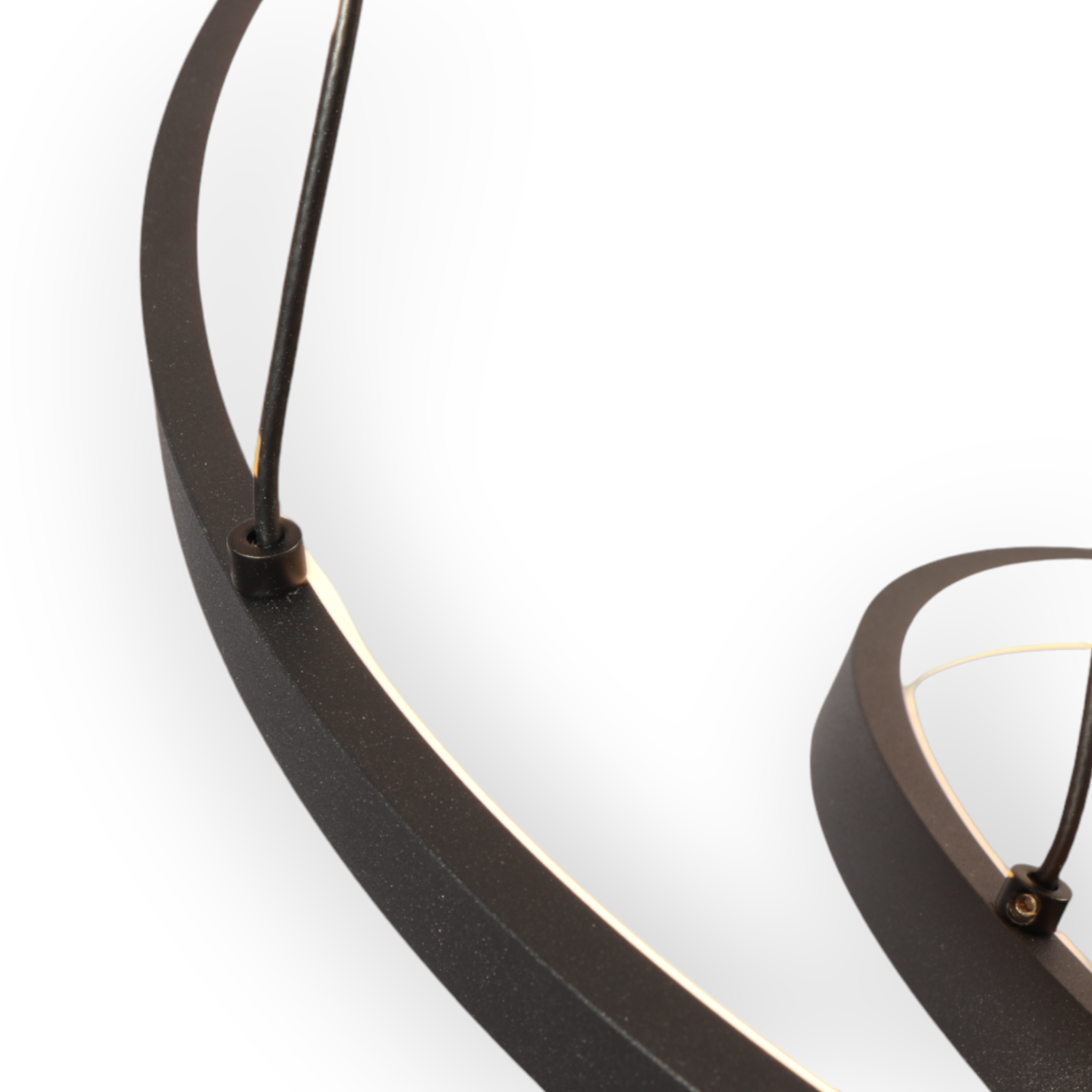 Image showcasing the Astral Trinity Chandelier with its sleek, modern design, featuring three interconnected circles elegantly suspended, casting a soothing 3000K glow in a contemporary interior setting.