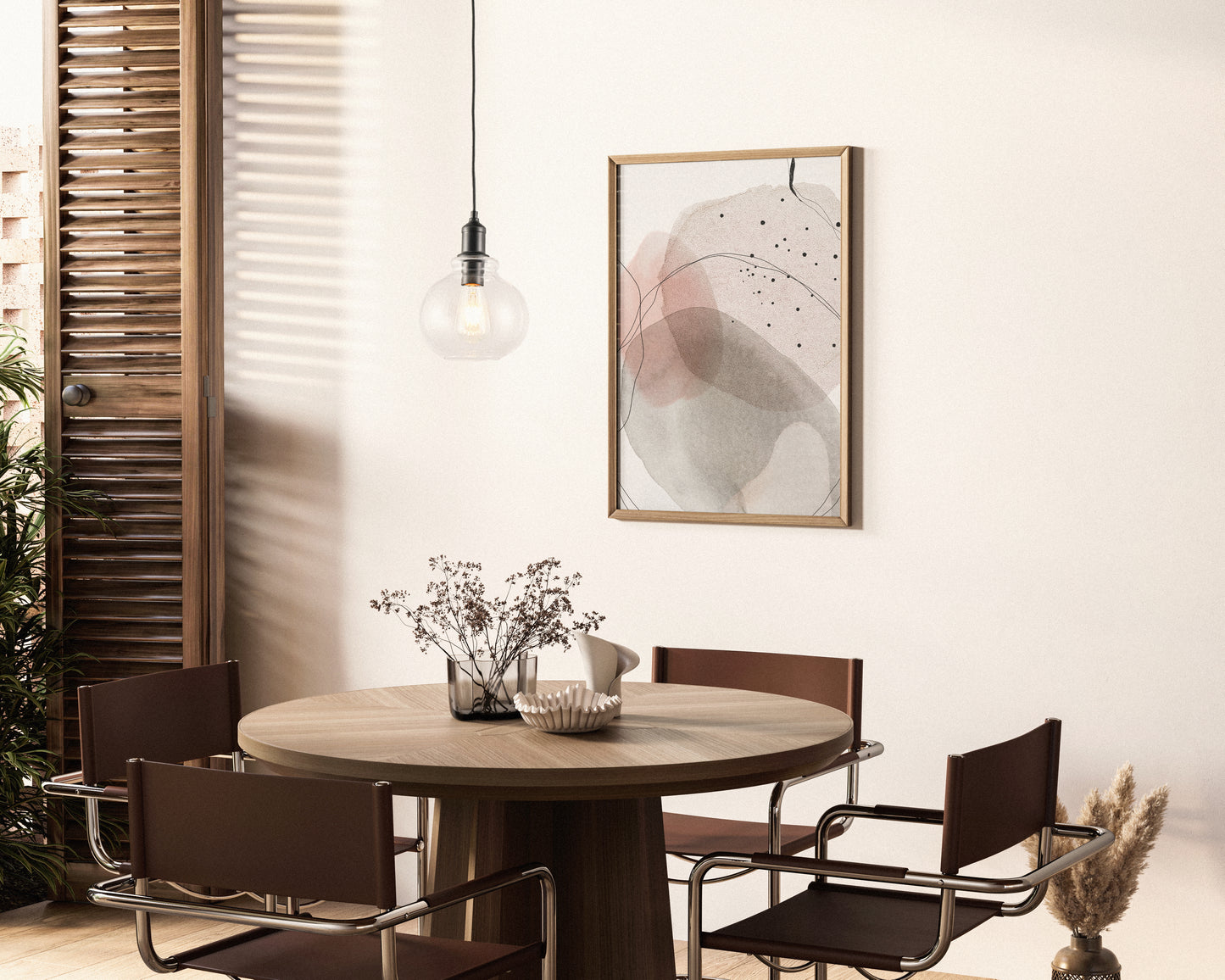 The image features the Olson 1L Pendant Light, showcasing a classic clear glass globe that houses a visible filament bulb. The simplicity of the design is complemented by the modern black accents, creating a versatile piece suitable for a variety of decors.
