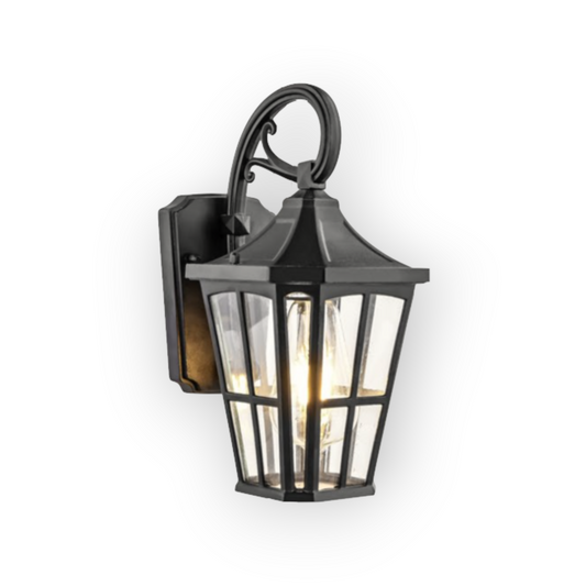 This image presents the Avery External Wall Light, elegantly designed with a curved arm and lantern style, featuring clear glass panels and a sophisticated black finish. The vintage design provides a charming and welcoming glow, perfect for enhancing the ambiance of any outdoor area.