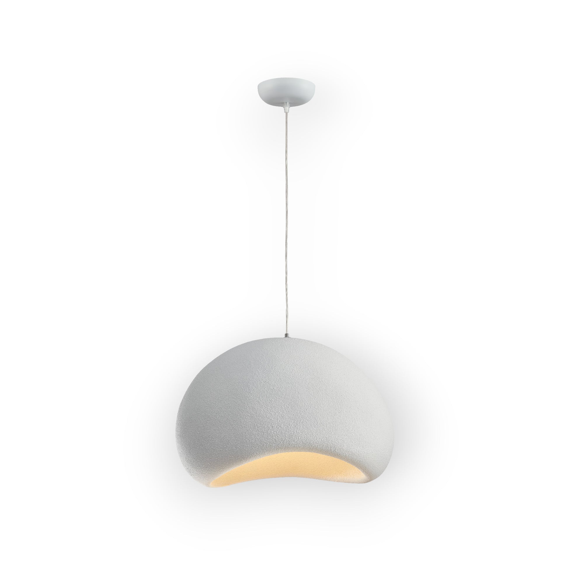 The image features the Cove Pendant, displaying a unique semi-circular design with a textured matte finish and a warm, golden interior glow. This modern pendant light is suspended from a slim cable, offering a blend of contemporary style and cozy illumination.