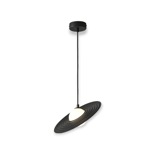 This image features the Lustre 1L Pendant Light, a striking piece with a concentric circular design in a matte black finish. Its sculptural form creates an engaging play of light and shadow, serving as a bold statement piece in any contemporary setting.