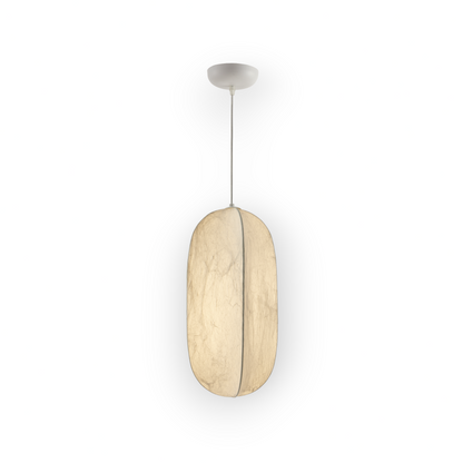 Captured here is the medium Lyra 1L Pendant, featuring an elegantly elongated Mulberry silk shade with a serene, organic texture. The pendant's smooth silk surface and balanced form emanate a soft, diffuse light, perfect for creating a warm ambiance."