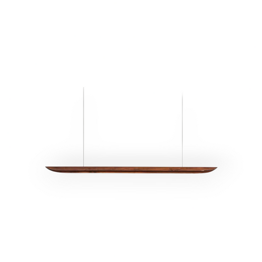 The image features the Maren Walnut Linear Pendant, a piece that marries the richness of walnut wood with a sleek linear form. Hanging gracefully from two cables, it exudes a sense of elegance and warmth, suitable for a refined interior design.