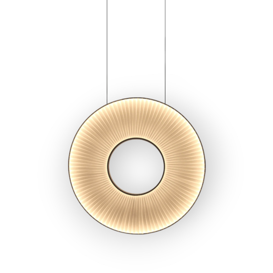 This image reveals the Noa 1L Pendant Light, exuding a soft, golden glow from its circular, textured surface. The pendant's design is reminiscent of sun-etched patterns, creating a warm, diffused light that is both inviting and serene.