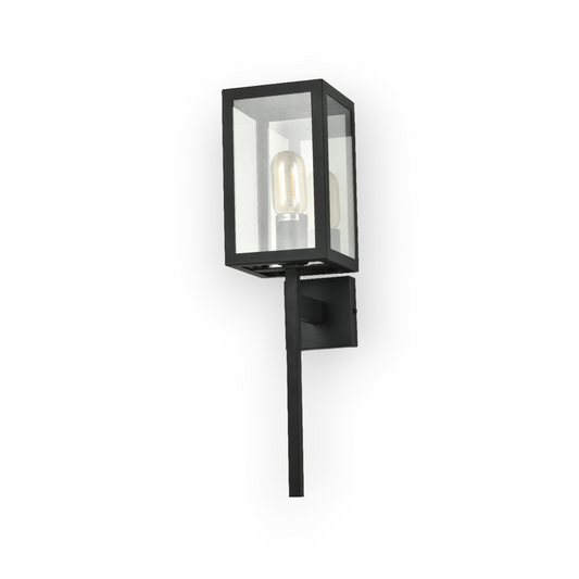 A contemporary Weston wall light featuring a matte black finish and clear glass enclosure that allows the Edison-style bulb within to become a focal point of the design. The wall light's clean lines and industrial influence are well-suited to modern decor themes.